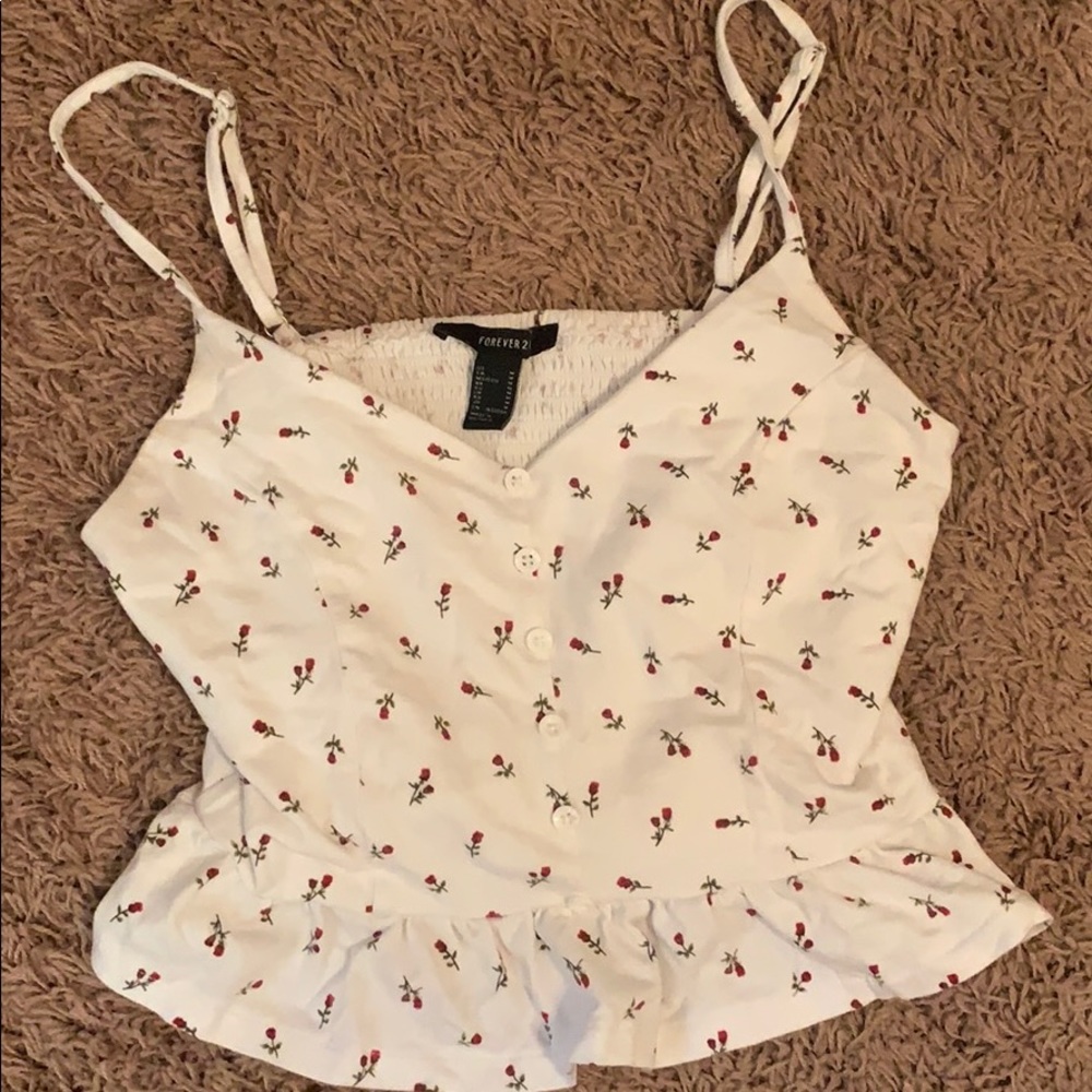 A white shirt with beautiful roses on it